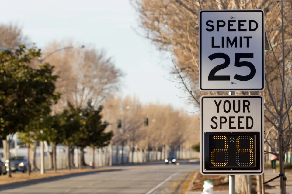 25mph speed limit sign with digital "Your Speed" sign below it.
